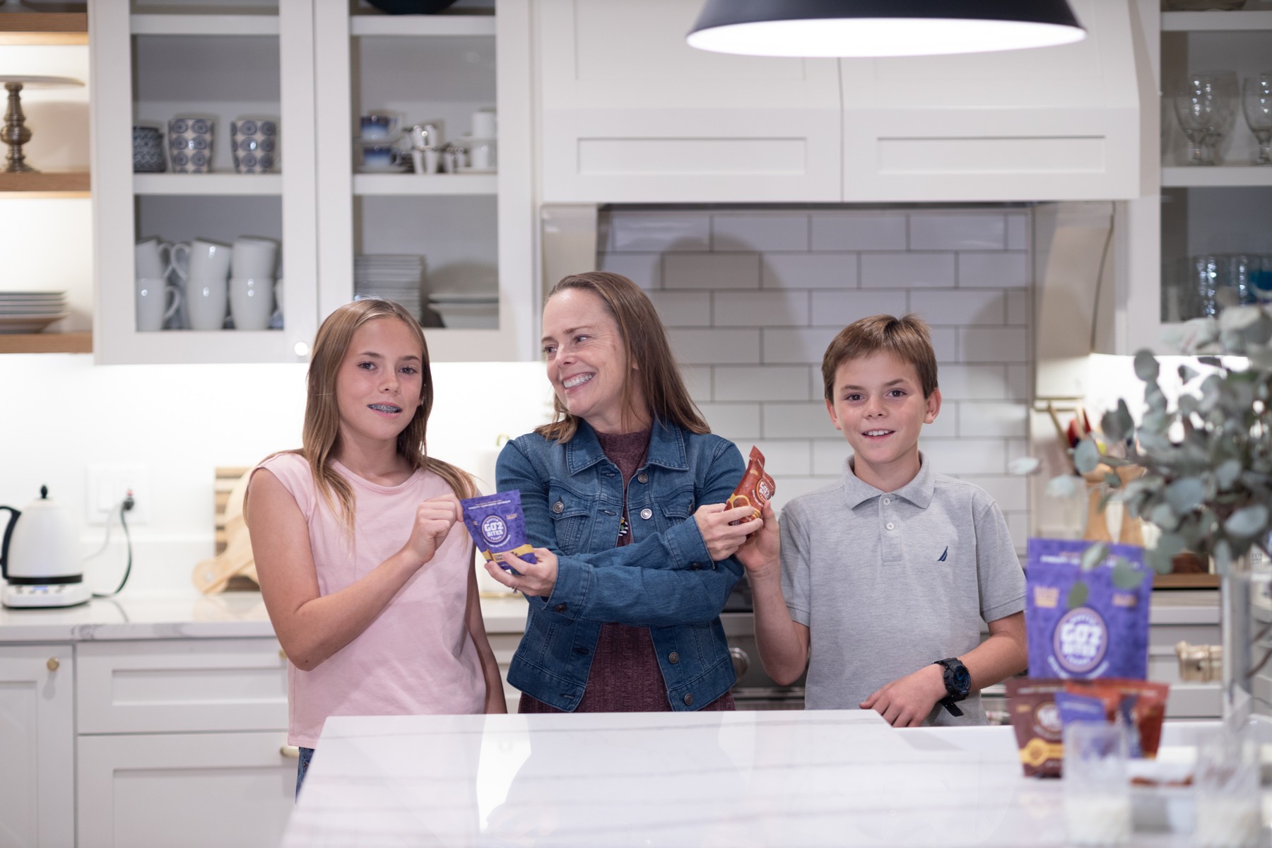 A kitchen scene places the product in a family setting.
